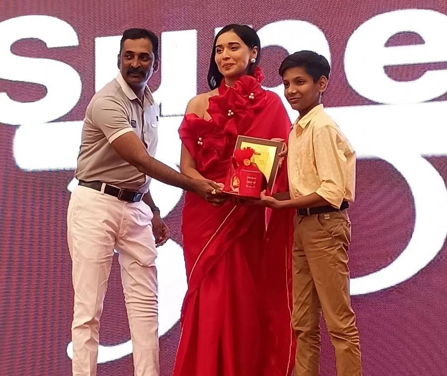 Shiv receiving a plaque on stage at Super 30+ Awards Season 2